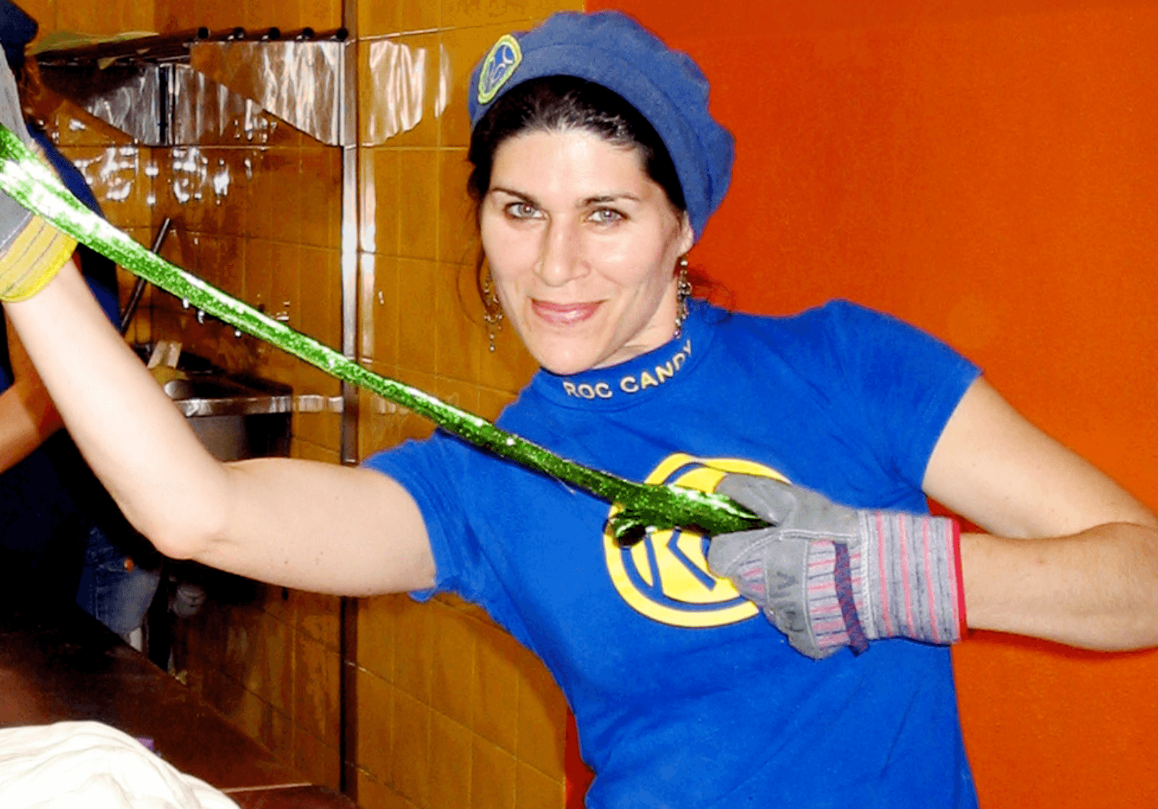 Roc Candy confectioner hand-pulling green candy